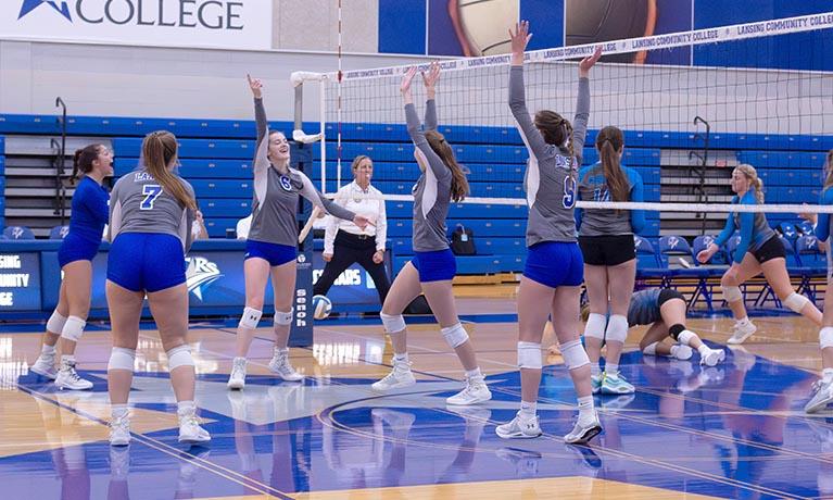 Volleyball improves record